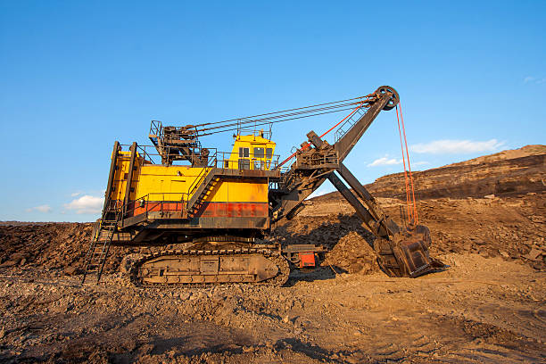 istock coal-preparation plant. Big yellow mining truck at work site 533247115