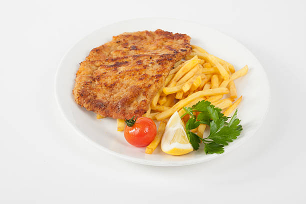 Wiener Schnitzel with french fries stock photo