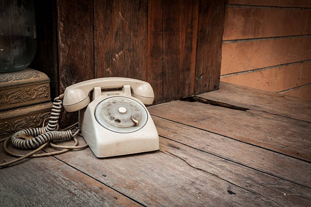 istock Vintage phone on wood background 533248427