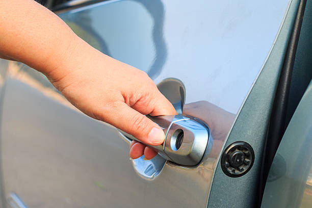 istock female's hand opening a car door 533249852