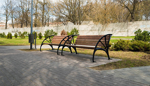 istock Empty wooden bench in the city park 533251738