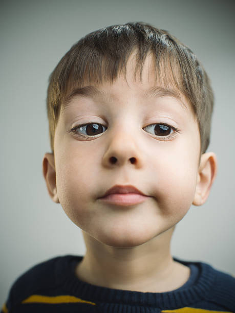 istock Portrait of a 4 years old boy with bored expression 533253800
