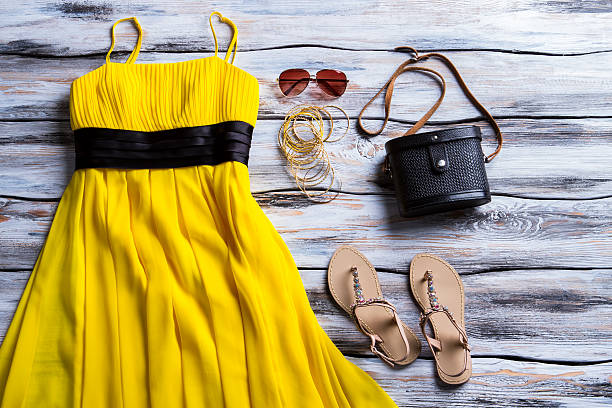 istock Yellow dress and beige sandals. 533254034