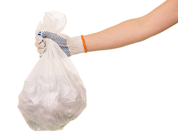istock Garbage bags waste in  hand isolated on white background 533254110