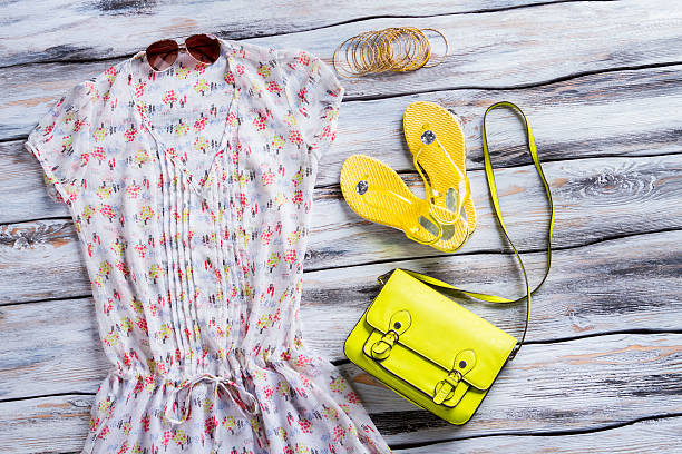 istock Yellow flip flops and blouse. 533254890