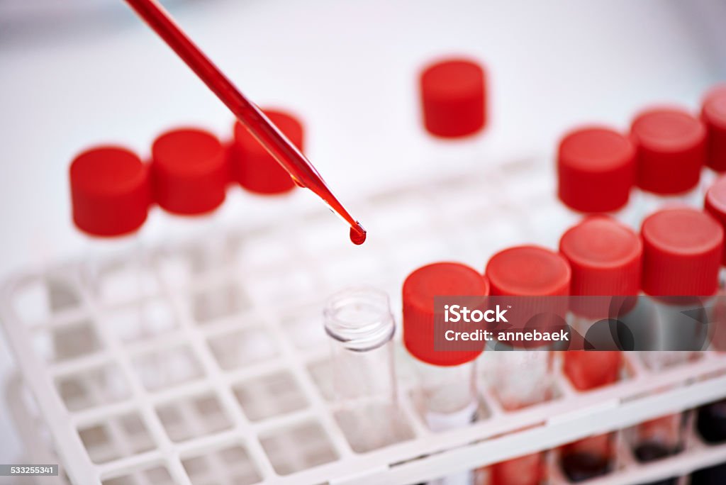 Your blood tells a story Closeup shot of a scientist working with blood samples in the lab 2015 Stock Photo