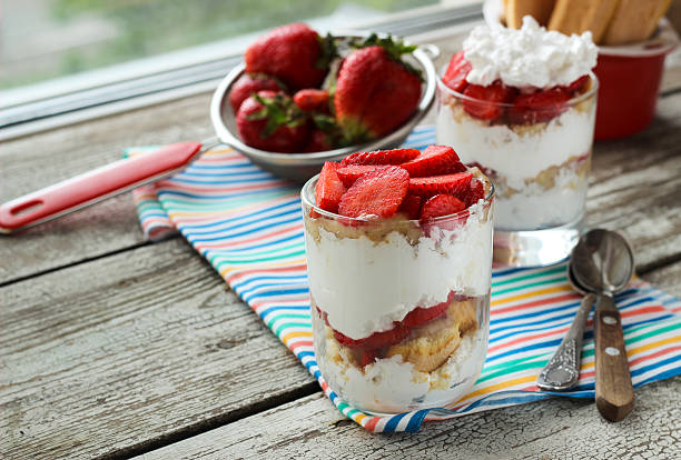 istock Strawberries dessert with biscuit and cream served on glasses 533255856