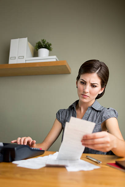 istock Serious woman paying bills 533256199