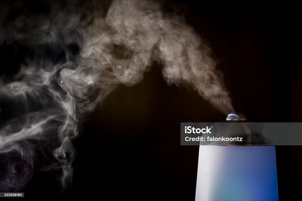 Essential oil diffuser Essential oils being diffused into the air. 2015 Stock Photo