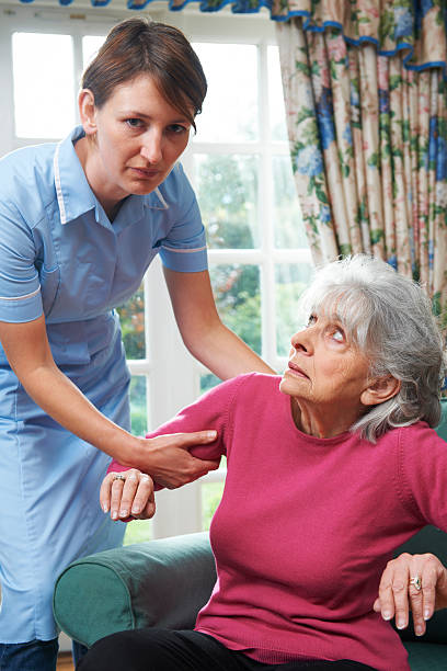 istock Care Worker Mistreating Elderly Woman 533259033