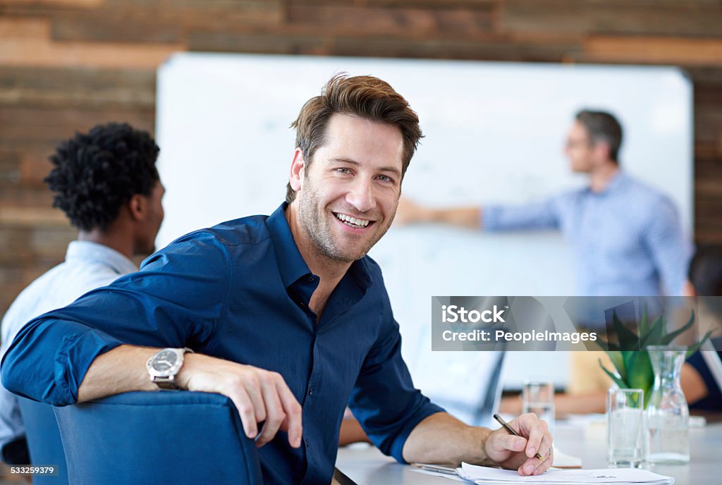 Making my creativity work for me Portrait of a handsome creative professional smiling at the camera in a modern conference room 2015 Stock Photo