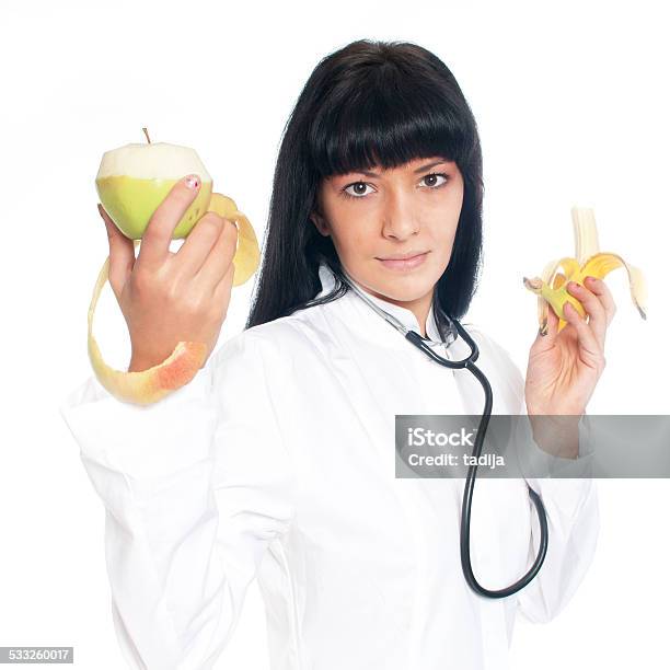 Doctor Nutritionist With Fruit Stock Photo - Download Image Now - 2015, Adult, Apple - Fruit