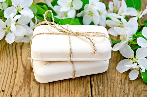 istock Soap with white flowers of apple on board 533260783