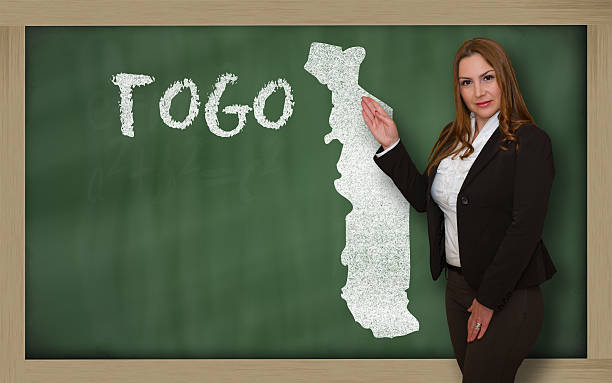 istock Teacher showing map of togo on blackboard 533262599