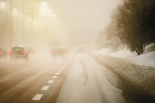 istock Road with traffic and heavy fog 533272683