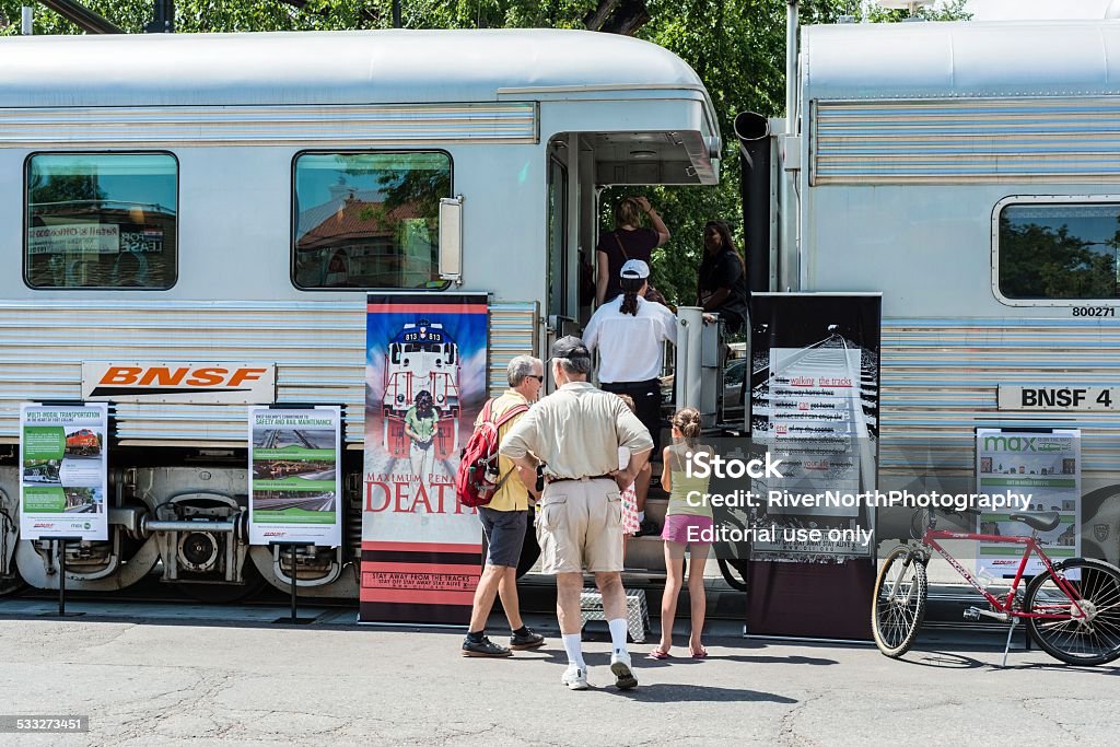 BNSF Train, Burlington Northern Santa Fe Fort Collins, Colorado, USA - August 24, 2013: People in line to board a BNSF train which is on display in downtown Fort Collins. Burlington Northern Santa Fe is a major railway operator and part of Warren Buffett's Berkshire Hathaway. 2015 Stock Photo