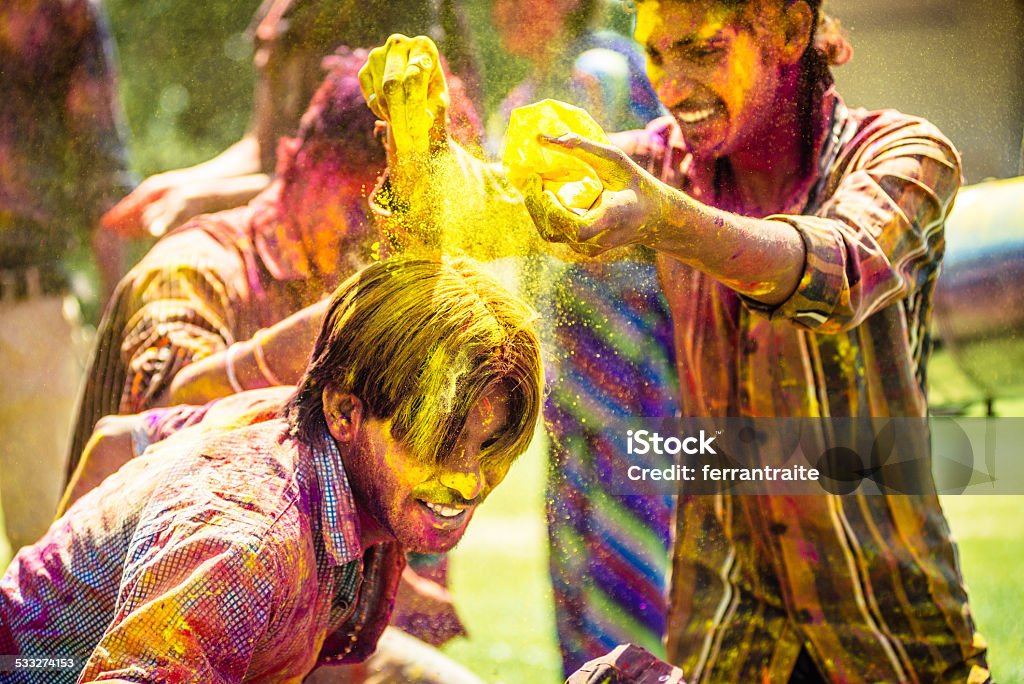 Indian friends throwing Holi Colorful Powder at each other Indian friends throwing Holi Colorful Powder at each other. India. Holi Stock Photo