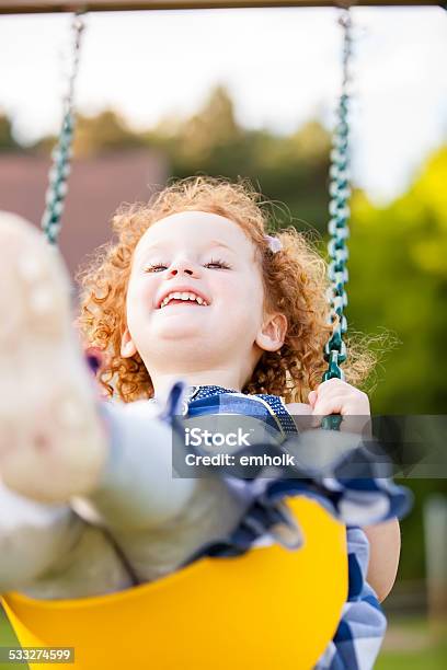 Girl On Yellow Swing Stock Photo - Download Image Now - 2-3 Years, 2015, Candid