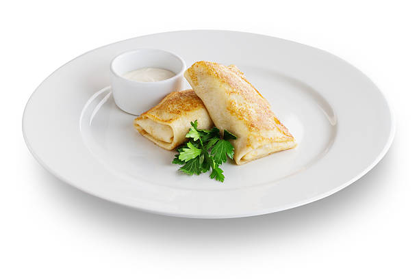 istock Set of pancakes on white plate with sour cream 533274865
