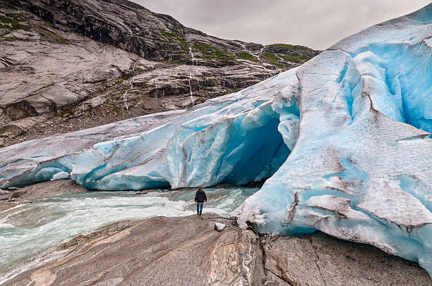 istock Jostedalsbreen glacier with the glacial river and man in Norway 533275499