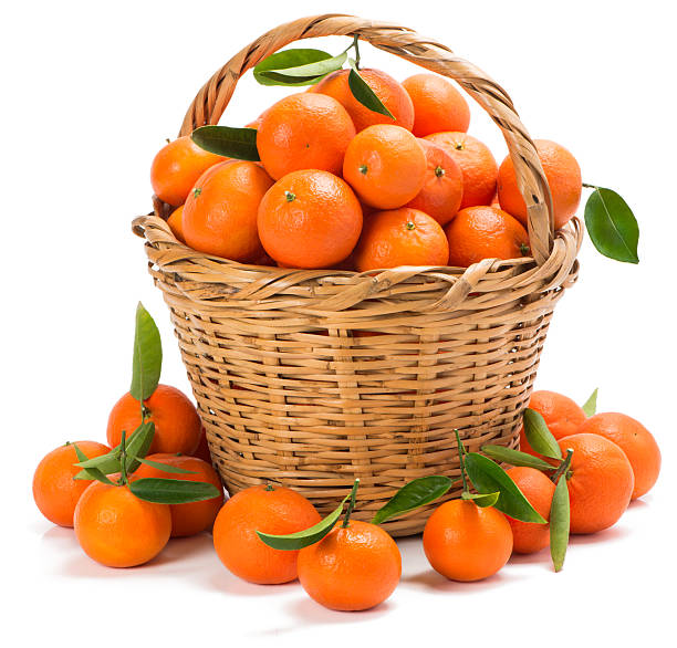 istock ripe tangerines with leaves in a basket 533276045