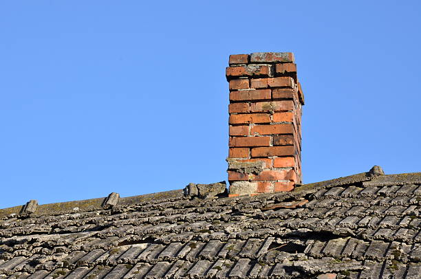 istock Old roof with brick chimney 533276087