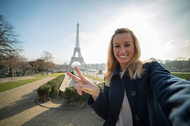 istock Young woman taking selfie at the Eiffel tower 533277225