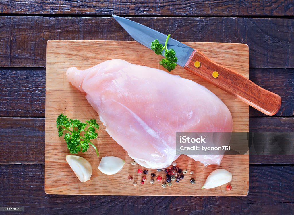 raw chicken raw chicken fillet on the wooden board 2015 Stock Photo