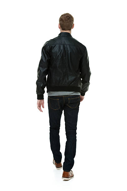 istock Rear view of man in jacket & walking 533278861