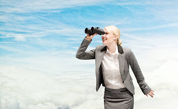 istock Smiling businesswoman searching with binocular 533278879