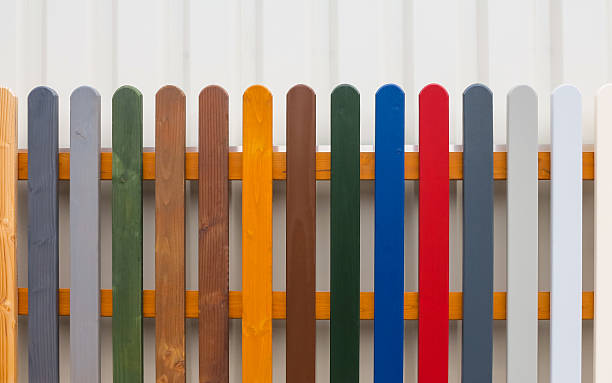 Colorful Fence Colorful fence with wooden slats in different colors. tempera painting variation abstract colors stock pictures, royalty-free photos & images