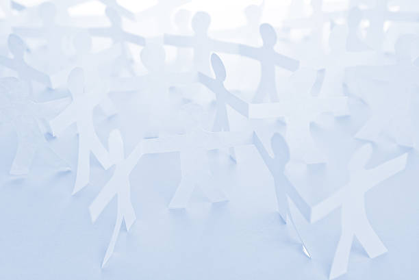istock People Paper Cut Chain as Crowd or Teamwork Concept 533290507