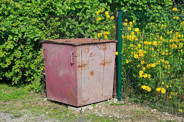 istock Old metal garbage container on  street 533295887