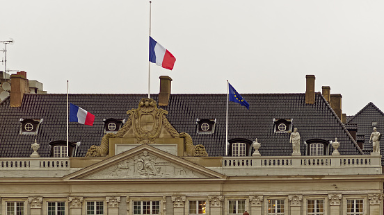 COPENHAGEN, DENMARK - JANUARY 08: Flags of the French embassy is lowered i mourning after the terrorist attack on the 7'th of January 2015