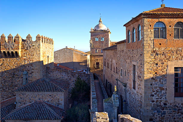 View to the buildings and roofs of the Old Town of Caceres in the morning with first sunlight.