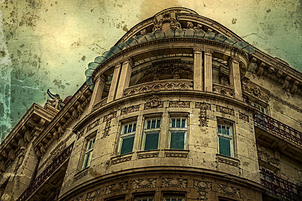 Old photo. Stone facade on classical building with ornaments and sculptures. Belgrade, Serbia. Vintage processed.