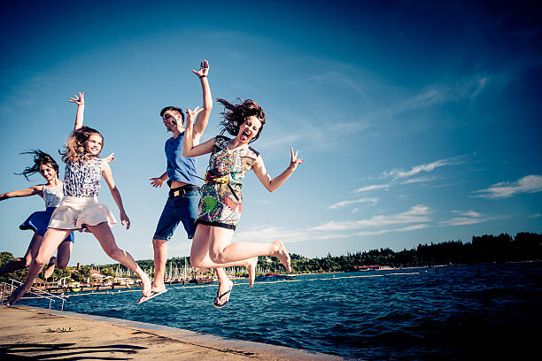 istock young friends having fun by the sea 533309815