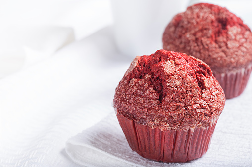 Red velevt muffins on white with copy space