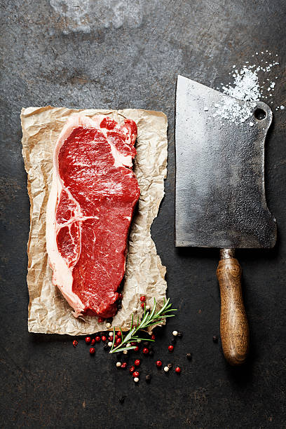 istock vintage cleaver and raw beef steak 533311987