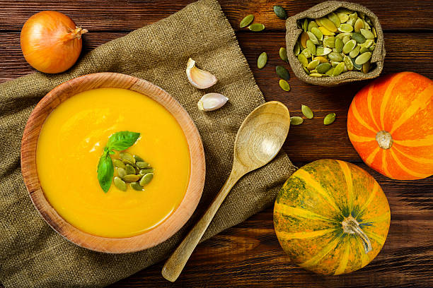 istock Homemade Autumn Butternut Squash Soup rustic wooden table 533313299