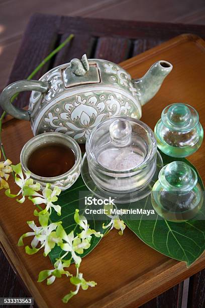 Spa Ginger Tea With Orchid And Massage Oils Stock Photo - Download Image Now - Ginger - Spice, Peppermint, Tea - Hot Drink