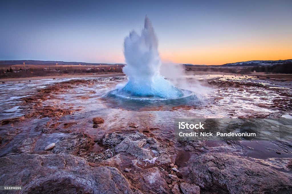 Spectacular geotermal eruption of Gullfoss Geysir after sunset Iceland Spectacular well timmed capture of geotermal eruption at Gullfoss Geysir, The Great Geysir or Stokkur Geyser the most energetic spouting spring up to 40 meters in Iceland after sunset in twilight. Shot on Canon EOS 60D, 11mm wide lens, f4, ISO 800. Hot Spring Stock Photo