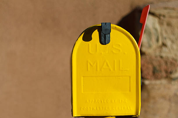 istock Yellow Mailbox in Sun with Flag Up 533314855