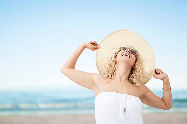 istock Happy woman on beach 533316301