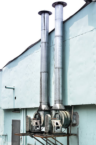 istock Two chimneys against the white sky background 533327120