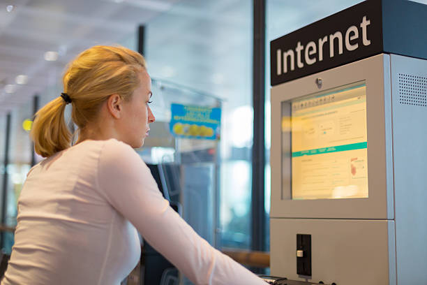 Woman public internet access point on airport.