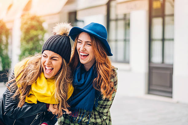 istock Two girls laughing on the street 533329532