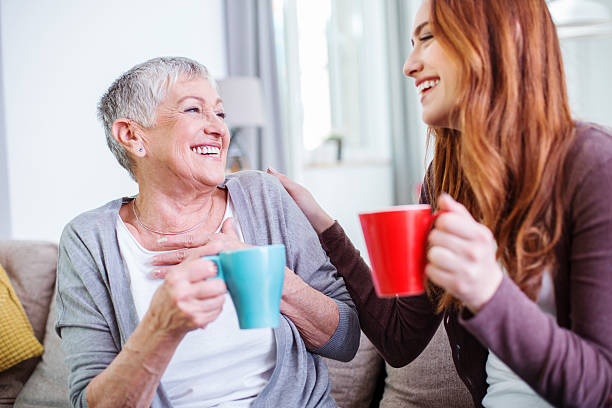istock Mother and dauther having hot drinks together 533330026