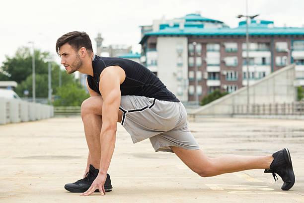 istock Fit young man doing stretches outdoors 533330288