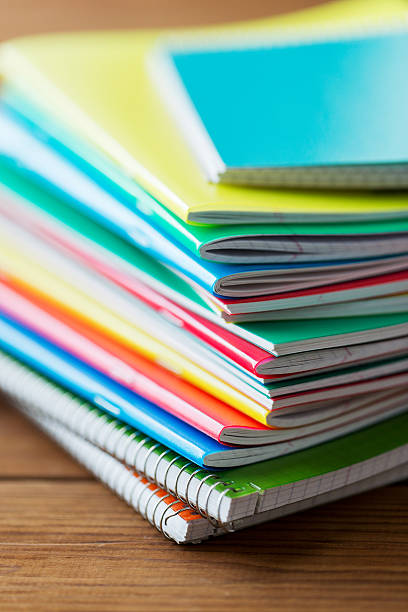 istock close up of notebooks on wooden table 533331056